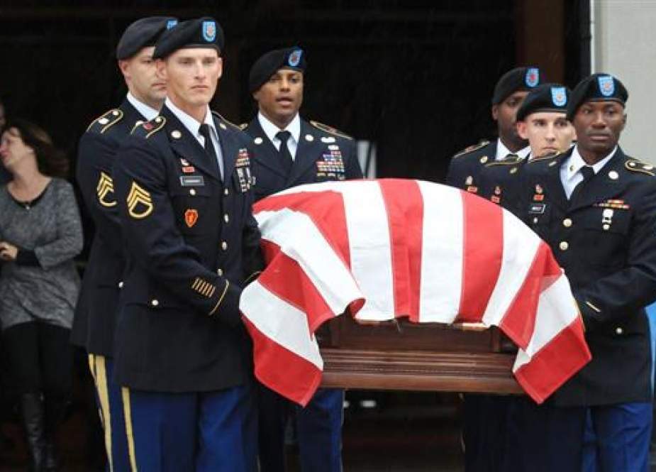 US service members carry the casket containing the remains of US Army Cpl. Donald Matney, who lost his life during the Korean War, at Lambert-St. Louis International Airport on November 18, 2016.