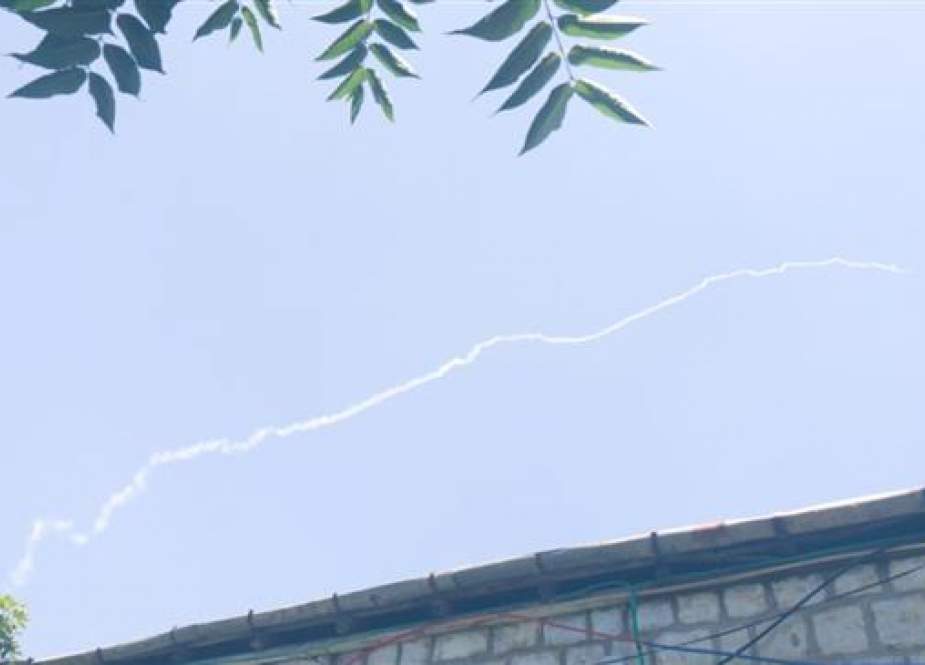 A trail of white smoke, purportedly belonging to an Israeli Patriot missile, is seen over Safed, a city in northern parts of the occupied Palestinian territories, June 24, 2018.