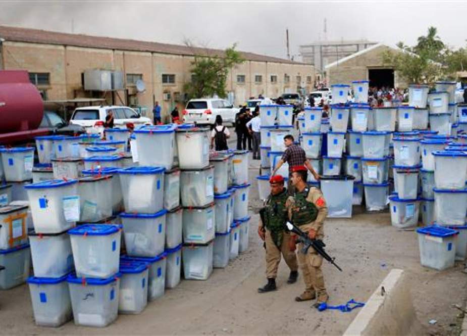 Ballot boxes are seen after a fire at a storage site in Baghdad, housing the boxes from Iraq