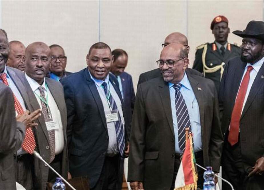 Sudan’s President Omar al-Bashir (2nd R) and South Sudan’s President Salva Kiir (R) react during the 32nd Extraordinary Summit of Intergovernmental Authority on Development (IGAD) in Addis Ababa on June 21, 2018. (Photo by AFP)