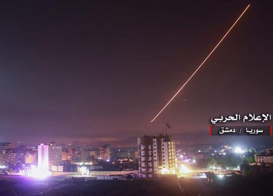 An image released on May 10, 2018 by the government-affiliated "Central War Media" in Syria purportedly shows Syrian air defense systems intercepting Israeli missiles over Damascus