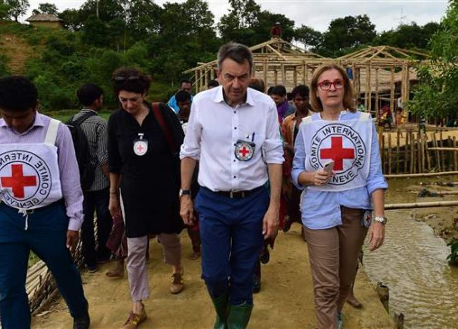 President of the International Committee of the Red Cross (ICRC) Peter Maurer (2R) visits Chakmarkul refugee camp in Teknaf, Bangladesh, July 1, 2018. (Photo by AFP)