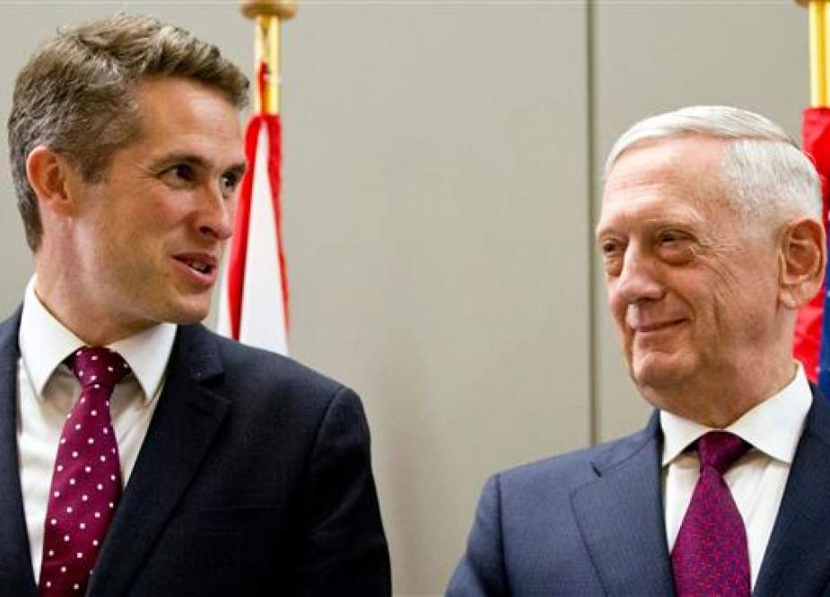 US Secretary for Defense Jim Mattis (R) speaks with British Defense Minister Gavin Williamson (L) prior to a meeting of NATO defense ministers at NATO headquarters in Brussels, on June 7, 2018. (Photo by AFP)
