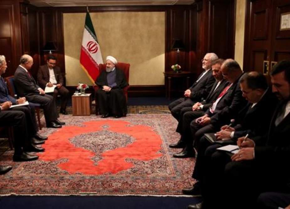 Iranian President Hassan Rouhani (C) meets with IAEA Director General Yukiya Amano (3rd L) in Vienna.jpg