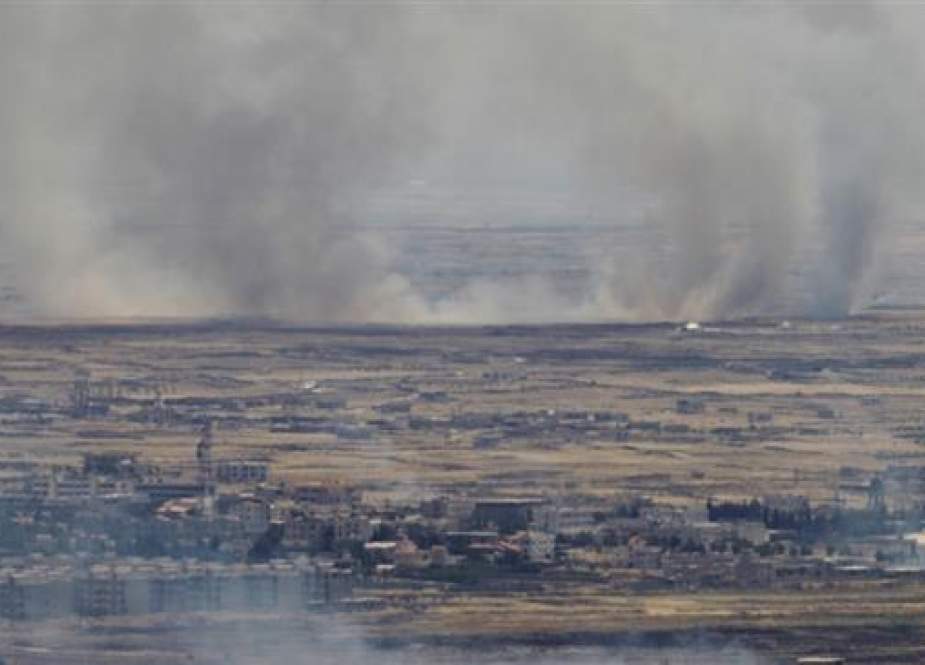 Israeli-occupied Golan Heights shows smoke billowing from the Syrian.jpg