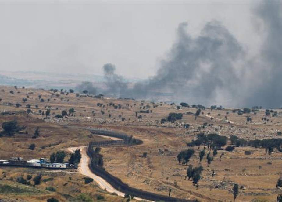 A picture taken from the Israeli-occupied Golan Heights shows smoke billowing from the Syrian side of the border on June 26, 2017. (Photo by AFP)