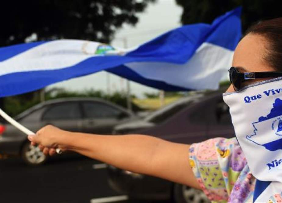 Anti-government activists hold a demonstration in Managua, Nicaragua, on July 3, 2018, demanding justice for those killed in recent protests, and the immediate resignation of Nicaraguan President Daniel Ortega and his wife and Vice President Rosario Murillo. (Photo by AFP)