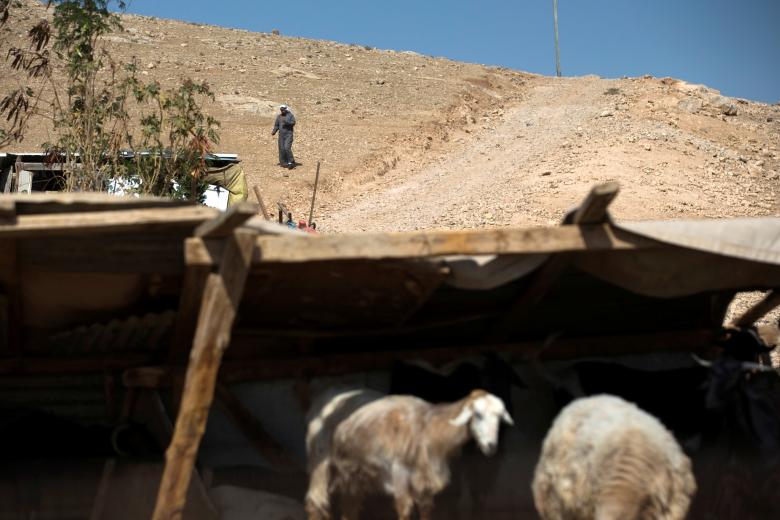 A Palestinian Bedouin man walks at al-Khan al-Ahmar near Jericho in the occupied West Bank.