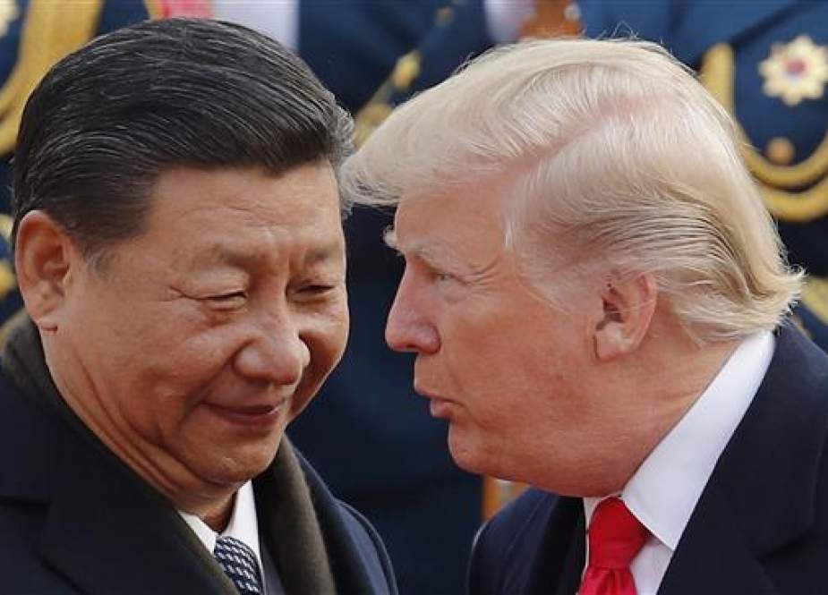 US President Donald Trump, right, visited China in early November 2017 and met with Chinese President Xi Jinping.
