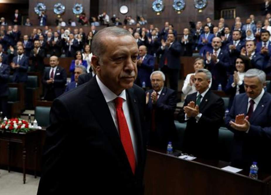 Turkish President Recep Tayyip Erdogan leaves his seat to address members of parliament from his ruling party in Ankara, Turkey, July 7, 2018. (Photo by Reuters)