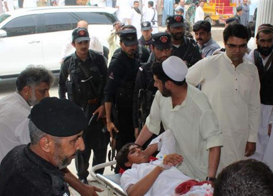 A Pakistani youth injured in a bomb blast is taken to a hospital in the country