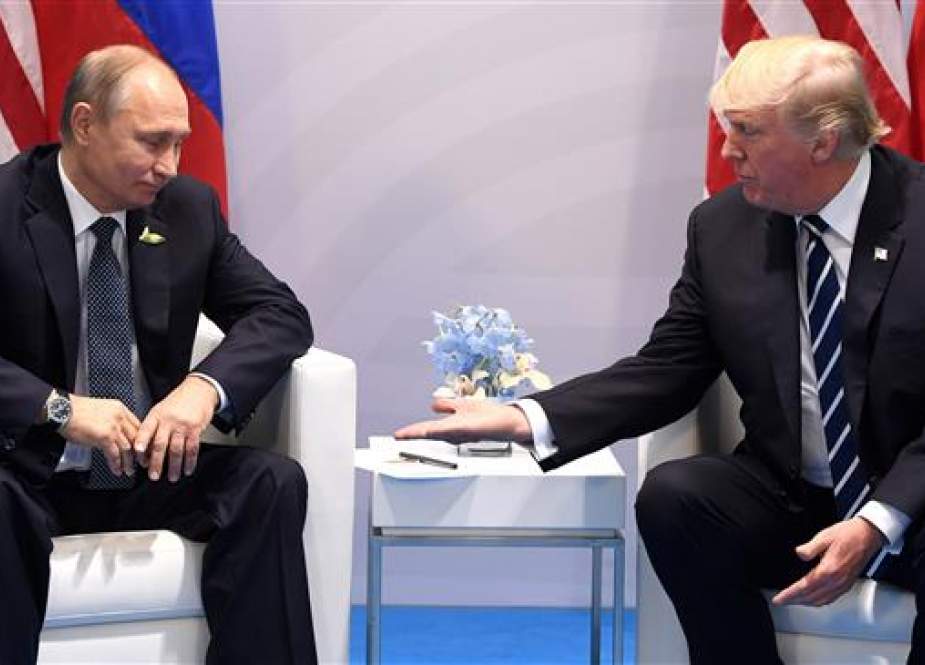 In this photo taken on July 07, 2017 US President Donald Trump (R) and Russia