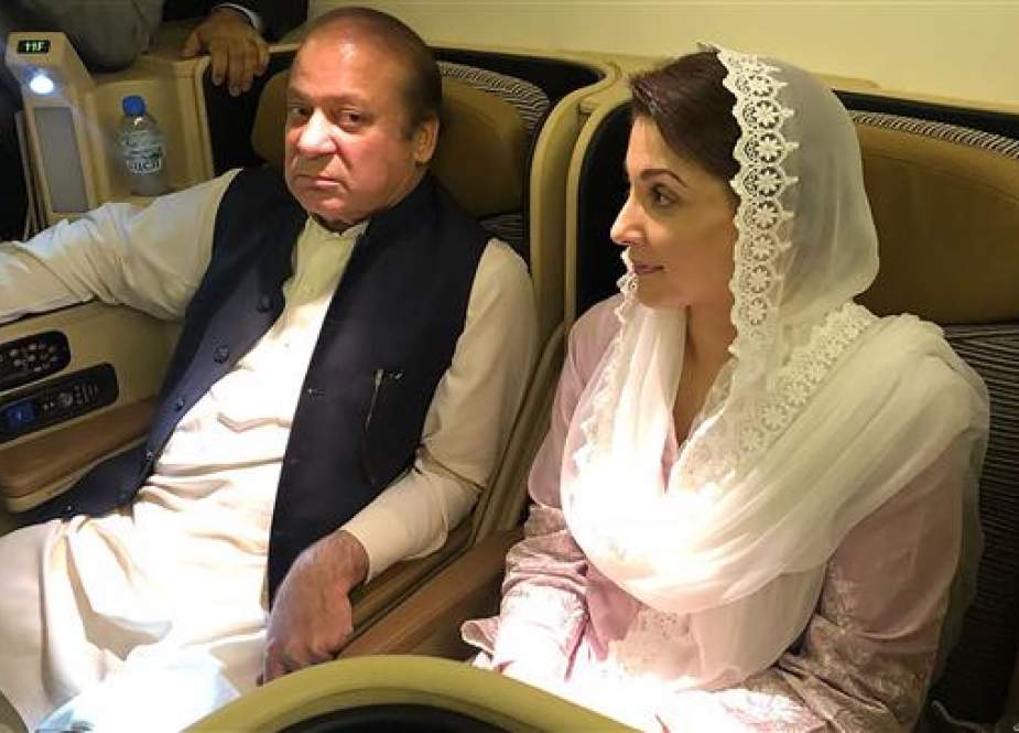 This handout photograph released by the Pakistan Muslim League Nawaz (PML-N) party on July 14, 2018, shows former prime minister Nawaz Sharif (L) and his daughter Maryam Nawaz sitting on a plane after their arrival in Lahore. (Photo by AFP)