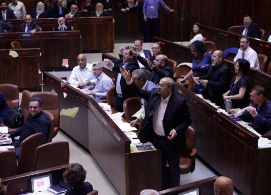 Arab lawmakers tear the nation-state bill in protest after it passes in the Israeli parliament.jpg