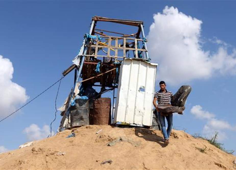 A Palestinian man removes a chair at a Hamas observation post that was targeted in Israeli shelling, in Khan Younis in the southern Gaza Strip on July 21, 2018. (Photo by Reuters)