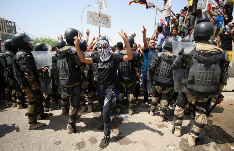 Protesters gather near the main provincial government building in Basra, July 15.