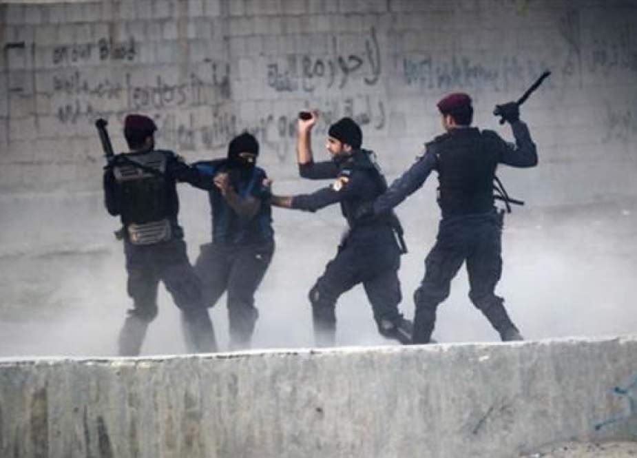 Bahraini forces arrest a protester during demonstration against the ruling Al Khalifah regime.jpg