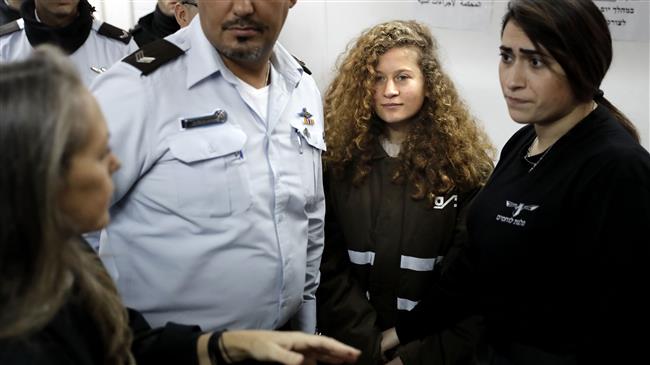 Palestinian activist and campaigner Ahed Tamimi, second right, arrives for the beginning of her trial in the Israeli military court at Ofer military prison in the West Bank village of Betunia, January 15, 2018.