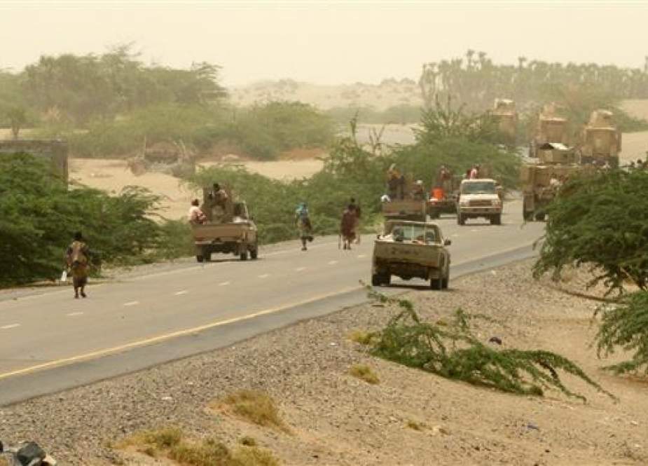 A column of Saudi-backed forces and armored vehicles arrives in Durayhimi district, about nine kilometers south of Hudaydah international airport on June 13, 2018. (Photo by AFP)