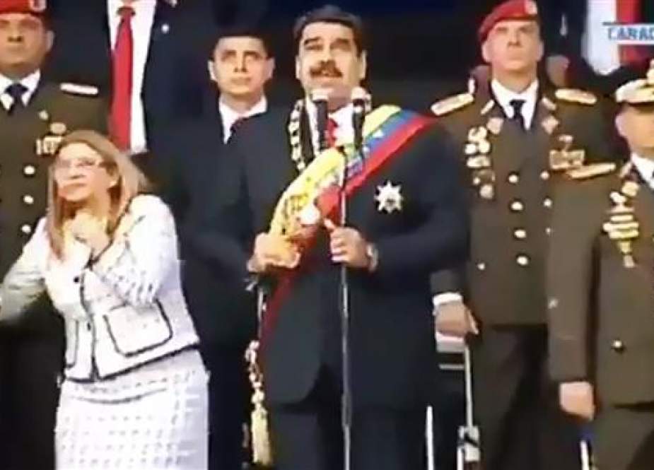 Venezuelan President Nicolas Maduro (C), his wife Cilia Flores (L) and military authorities.jpg