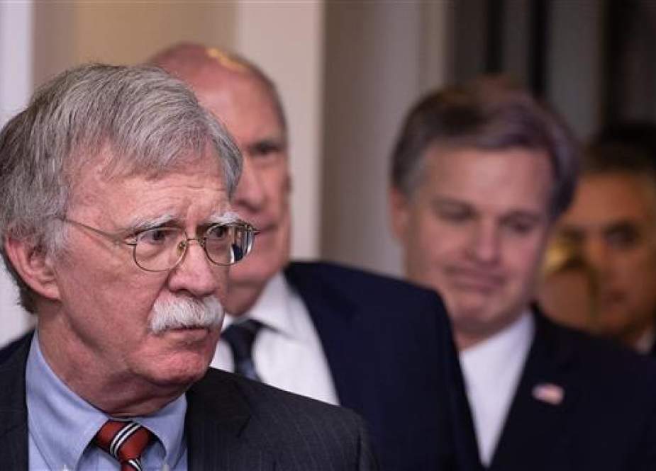 US National Security Advisor John Bolton (L), followed by National Director of Intelligence Dan Coats, FBI Director Christopher Wray and Commander of the US Cyber Command Gen. Paul Nakasone, arrive for the press briefing at the White House in Washington, DC, on August 2, 2018. (Photo by AFP)