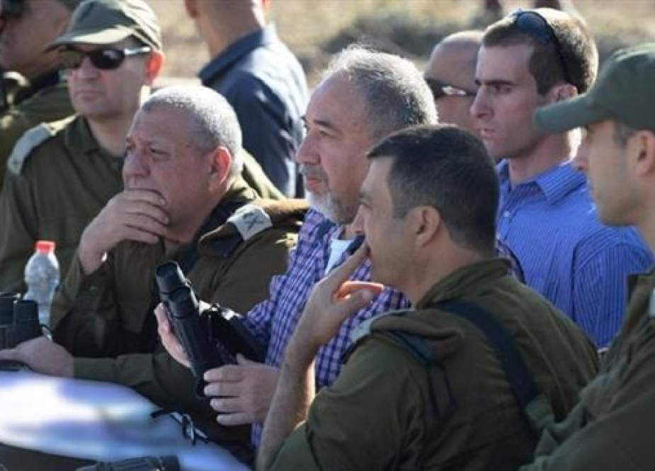 The file photo shows Avigdor Lieberman, the Israeli minister for military affairs (C), surrounded by a number of military officials during a visit to the norther parts of the occupied-territories.