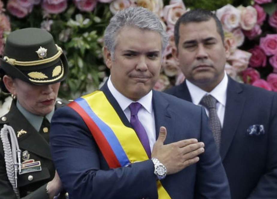 Colombia’s new president, Ivan Duque (C)