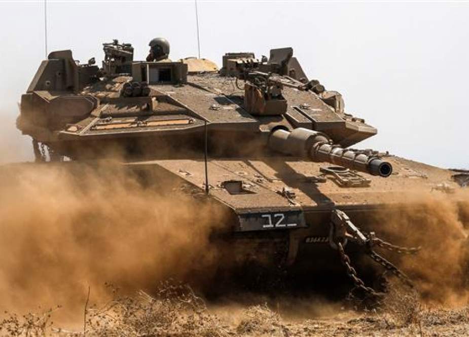 An Israeli Merkava battle tank is seen during war games in the Israeli-occupied Golan Heights along the border with Syria, on August 8, 2018. (Photo by AFP)
