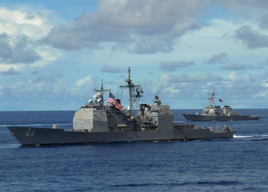 This photo released by the US Navy shows the USS Cowpens in formation during an exercise Aug. 14, 2007 off the coast of Guam in the Pacific Ocean.