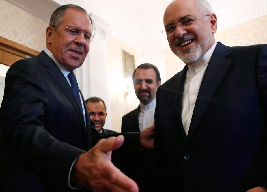Russian Foreign Minister Sergei Lavrov (L) and his Iranian counterpart Mohammad Javad Zarif smile during their meeting in Moscow, Russia, on May 14, 2018. (Photo by AFP)