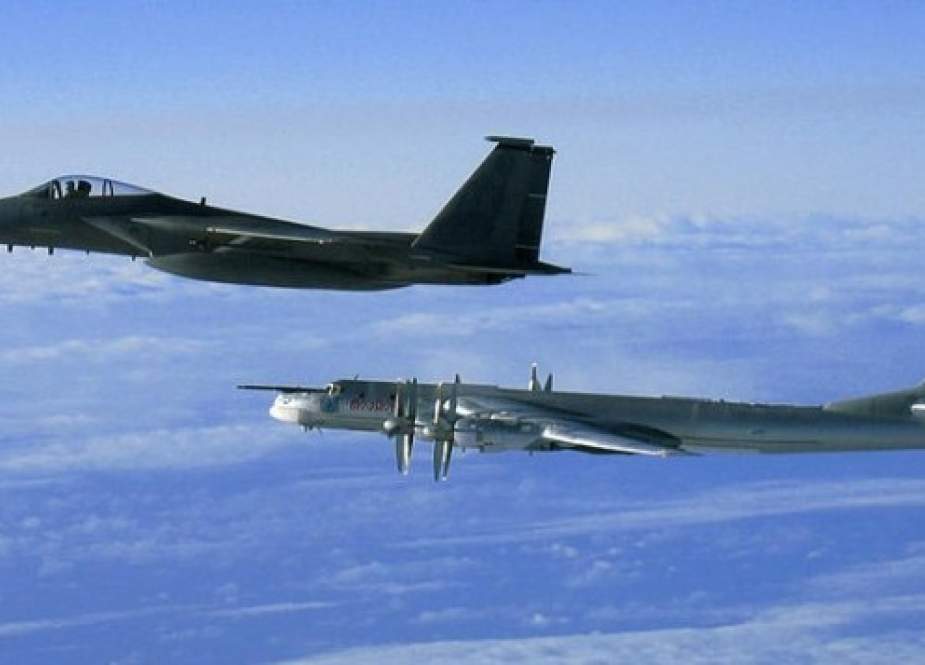 American F-15 intercepting a Russian Tu-95 Bear Bomber.jpg