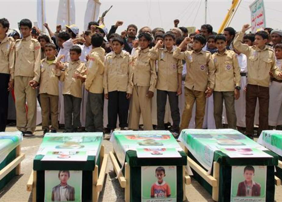 In this file photo taken on August 13, 2018, Yemeni children vent anger against Riyadh and Washington as they take part in a mass funeral in the northern Yemeni city of Sa