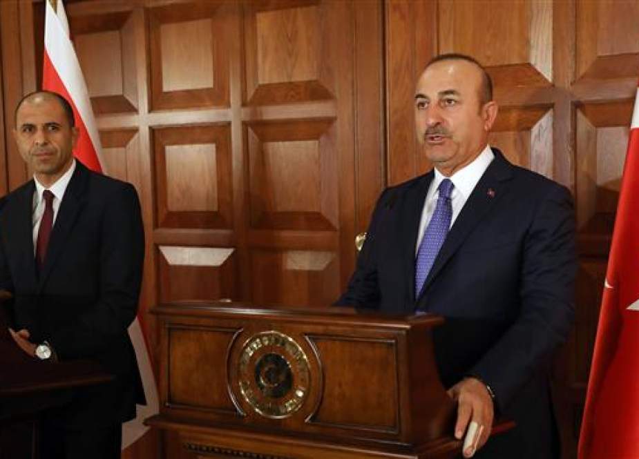 Turkish Foreign Minister Mevlut Cavusoglu (R) holds a joint press conference with Turkish Cypriot Minister of Foreign Affairs Kudret Ozersay following their meeting in Ankara, Turkey on September 3, 2018. (Photo by AFP)