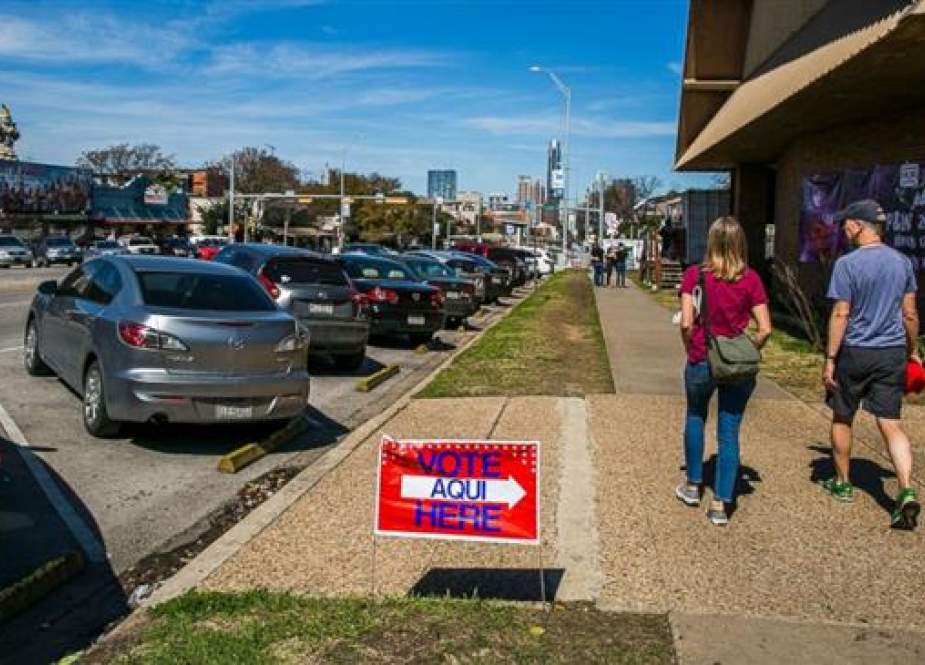 Pedestrians walk by The Church on South Congress, a designated voting location as Texans go to the polls for the nations first primary of 2018 on March 6, 2018 in Austin, Texas. (Photo by AFP)