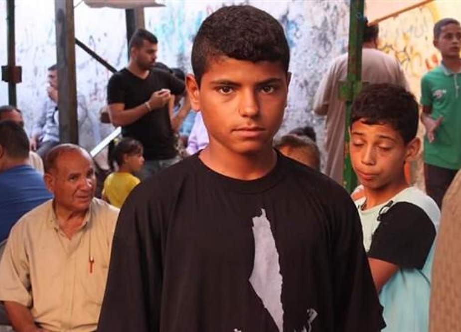 Slain 16-year-old Palestinian Ahmad Misbah Abu Toyour (C) (Photo by Palestine al-Yawm news agency)
