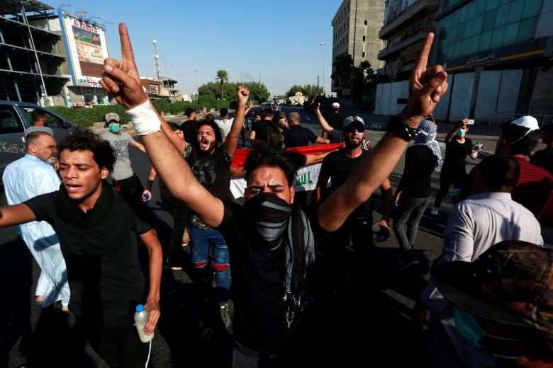 People shout slogans during a protest near the building of the government office in Basra, Iraq September 6, 2018.