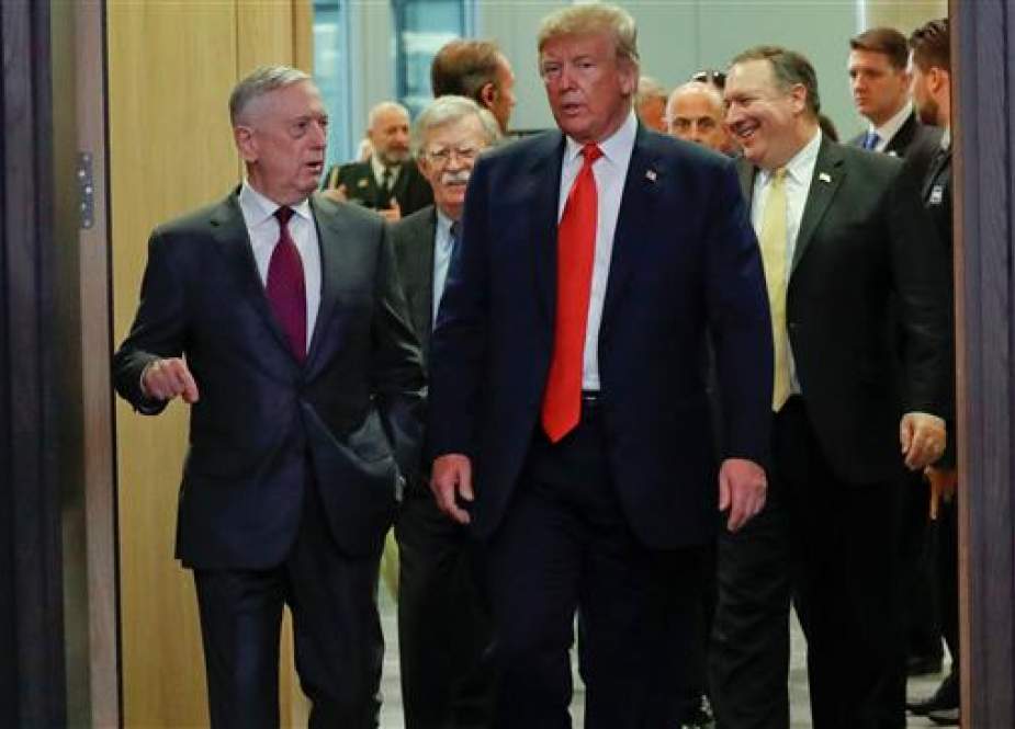 US President Donald Trump walks in with US Defense Secretary Jim Mattis