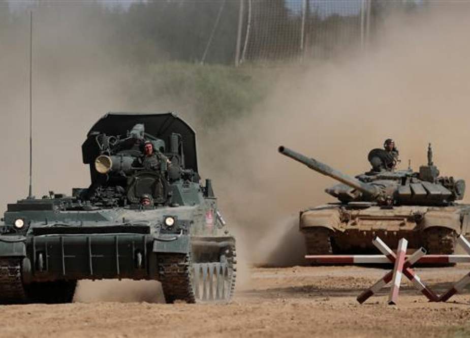 This file photo shows a Russian 2S4 Tyulpan self-propelled mortar and a T-72 B3 tank performing during the annual international military-technical forum “ARMY” in Alabino, outside Moscow, Russia, on August 23, 2018. (By Reuters)