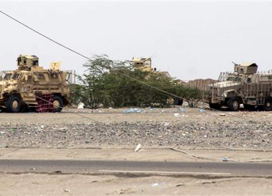 The file photo, taken on June 21, 2018, shows armored vehicles belonging to the Amalqa ("Giants") Brigades, loyal to the Saudi-backed former Yemeni government, parked on the side of a road during the offensive to seize the Red Sea port city of Hudaydah from Houthi fighters. (Photo by AFP)