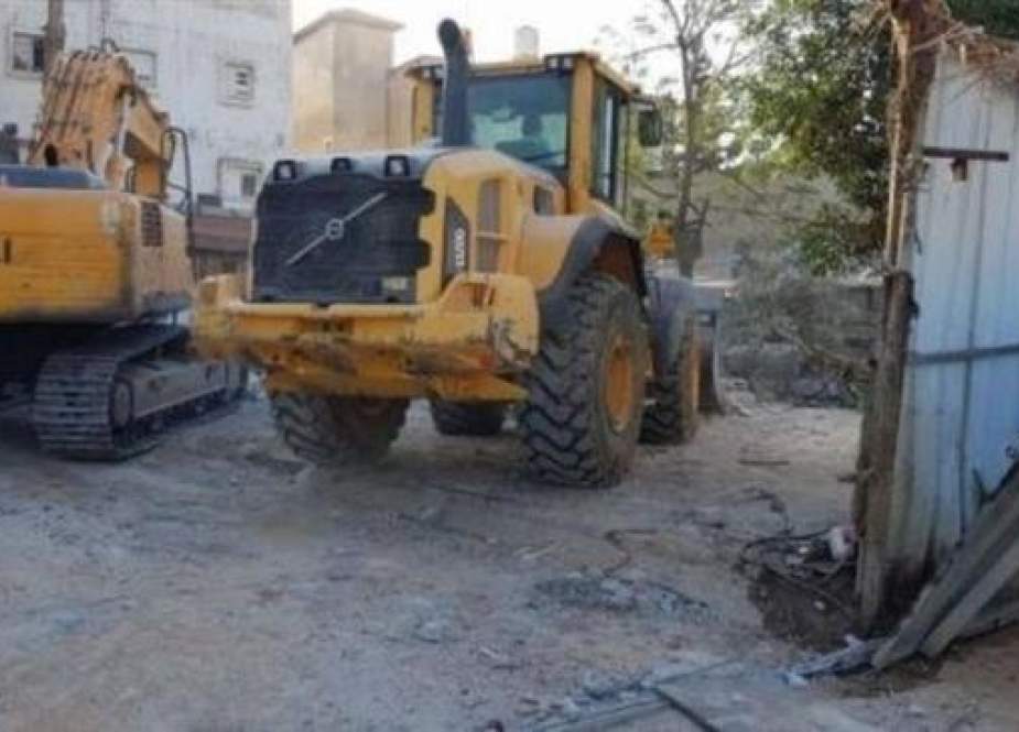 Israeli bulldozers destroy a home in the Palestinian neighborhood of al-Nakheel in al-Ramla City, in central occupied territories, on September 16, 2018.