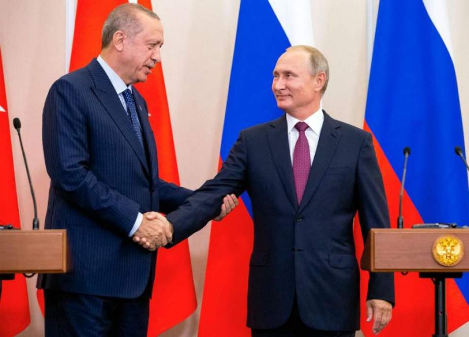Russian President Vladimir Putin (R) shakes hands with his Turkish counterpart, Recep Tayyip Erdogan, during their meeting at the Bocharov Ruchei residence in the Black Sea resort of Sochi on September 17, 2018. (Photo by AFP)