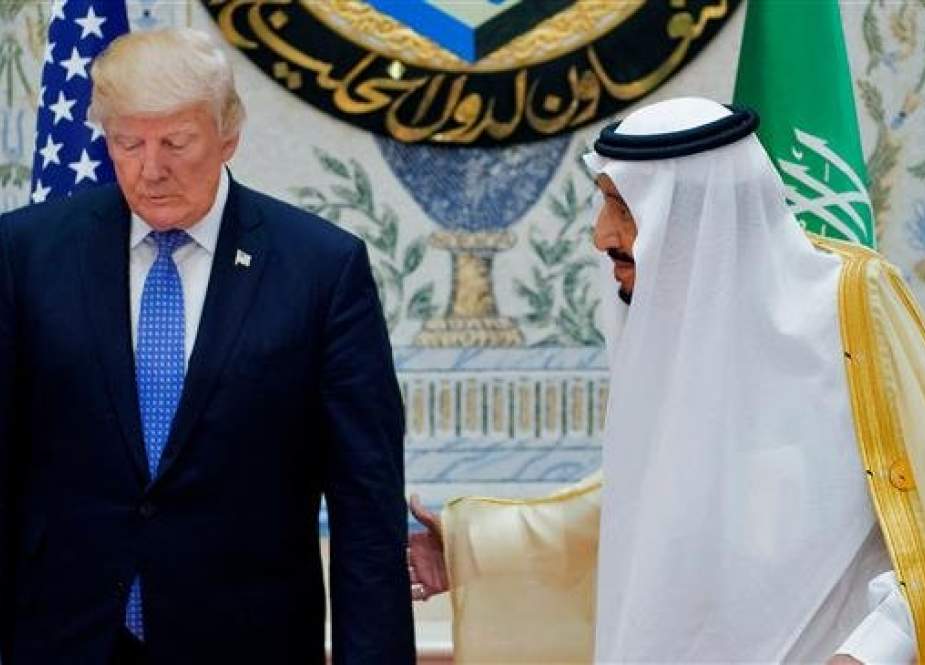 This file photo taken on May 21, 2017 and provided by the Saudi Royal Palace, shows Saudi King Salman (R) and US President Donald Trump.