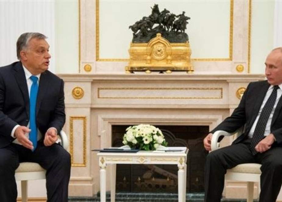 Hungarian Prime Minister Viktor Orban, left, speaks with Russian President Vladimir Putin.jpg