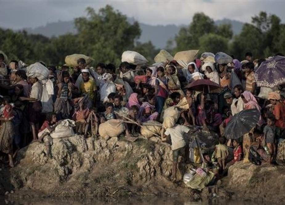 Rohingya refugees fleeing from Myanmar arrive at the Naf river in Whaikyang, Bangladesh border.