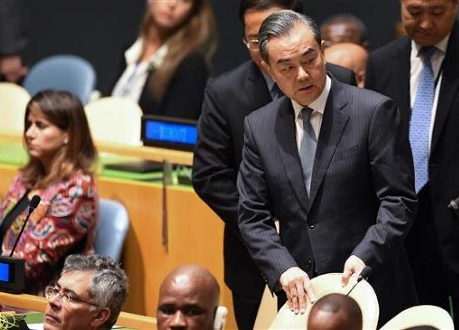 China’s Foreign Minister Wang Yi (R) arrives at the United Nations General Assembly in New York, on September 24, 2018. (Photo by AFP)