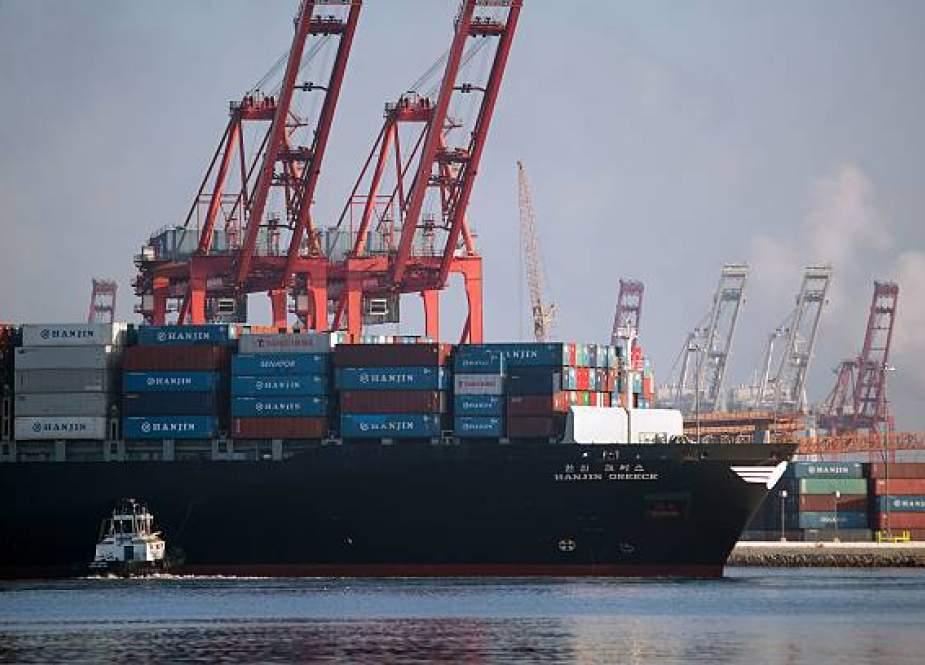 In this file photo taken on September 10, 2016, tug boats push the Hanjin Greece container ship to dock for unloading at the Port of Long Beach, California. America