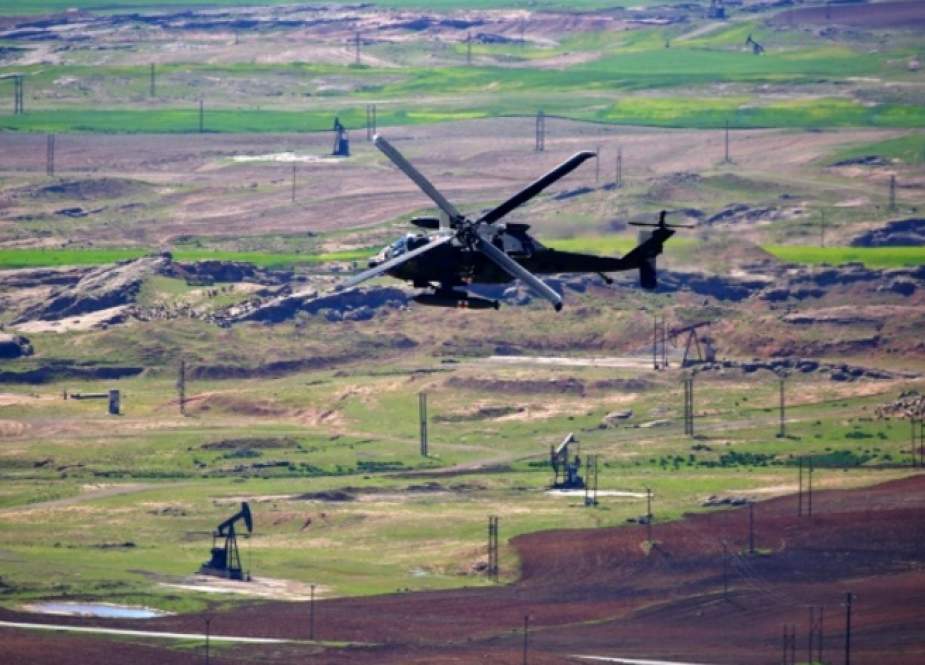A medical helicopter, from the US-led coalition, flies over the site of Turkish airstrikes near the Syrian city of al-Malikiyah on April 25, 2017. (Photo by AFP)