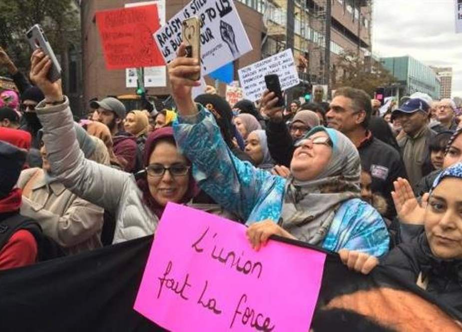 This photo taken from the website of Global News shows Muslim women attending an anti-racism rally in Montreal, Quebec Province, Canada, October 7, 2018.