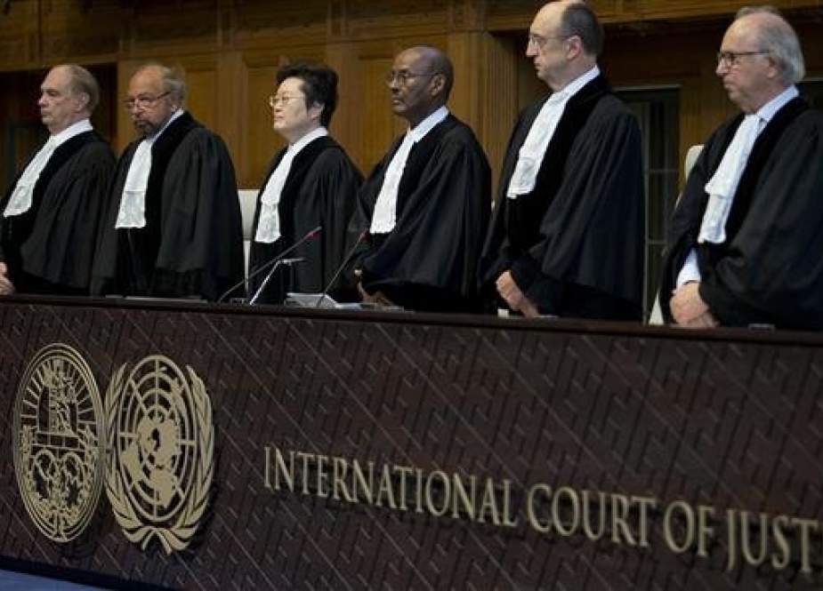 Judges enter the International Court of Justice, or World Court, in The Hague, Netherlands, Wednesday, Oct. 3, 2018, where they ruled on an Iranian request to order Washington to suspend US sanctions against Tehran. (Photo by AP)