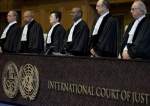 Judges enter the International Court of Justice, or World Court, in The Hague, Netherlands, Wednesday, Oct. 3, 2018, where they ruled on an Iranian request to order Washington to suspend US sanctions against Tehran. (Photo by AP)